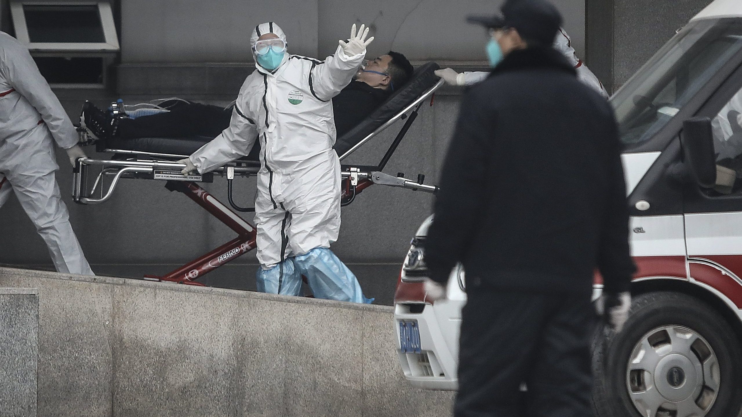 WUHAN, CHINA - JANUARY 17: (CHINA OUT) Medical staff transfer patients to Jin Yintan hospital on January 17, 2020 in Wuhan, Hubei, China. Local authorities have confirmed that a second person in the city has died of a pneumonia-like virus since the outbreak started in December. (Photo by Getty Images)