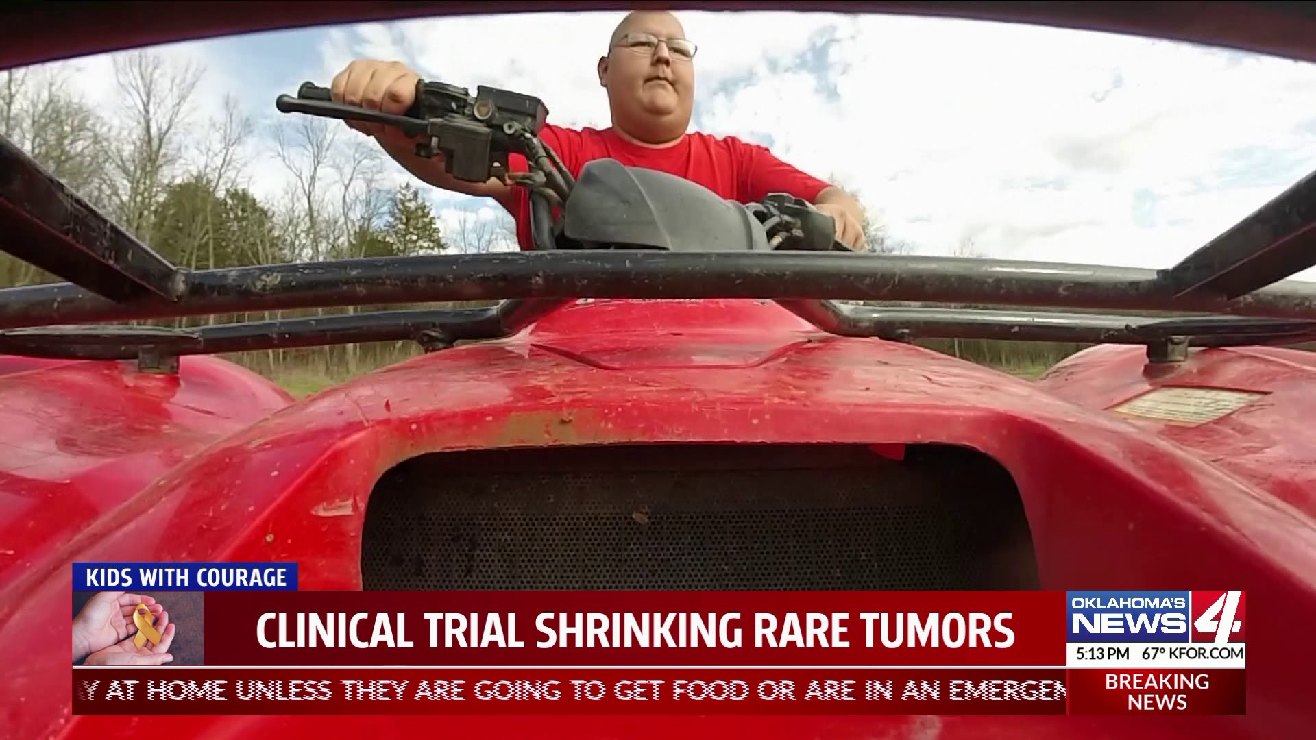 Young man rides four wheeler