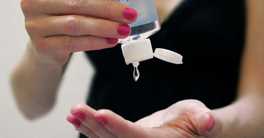 Woman Applying Hand Sanitizer