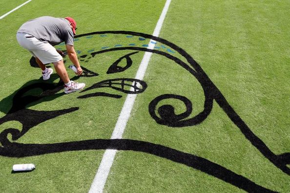 Tulane's Green Wave spray painted onto OU's Owen Field