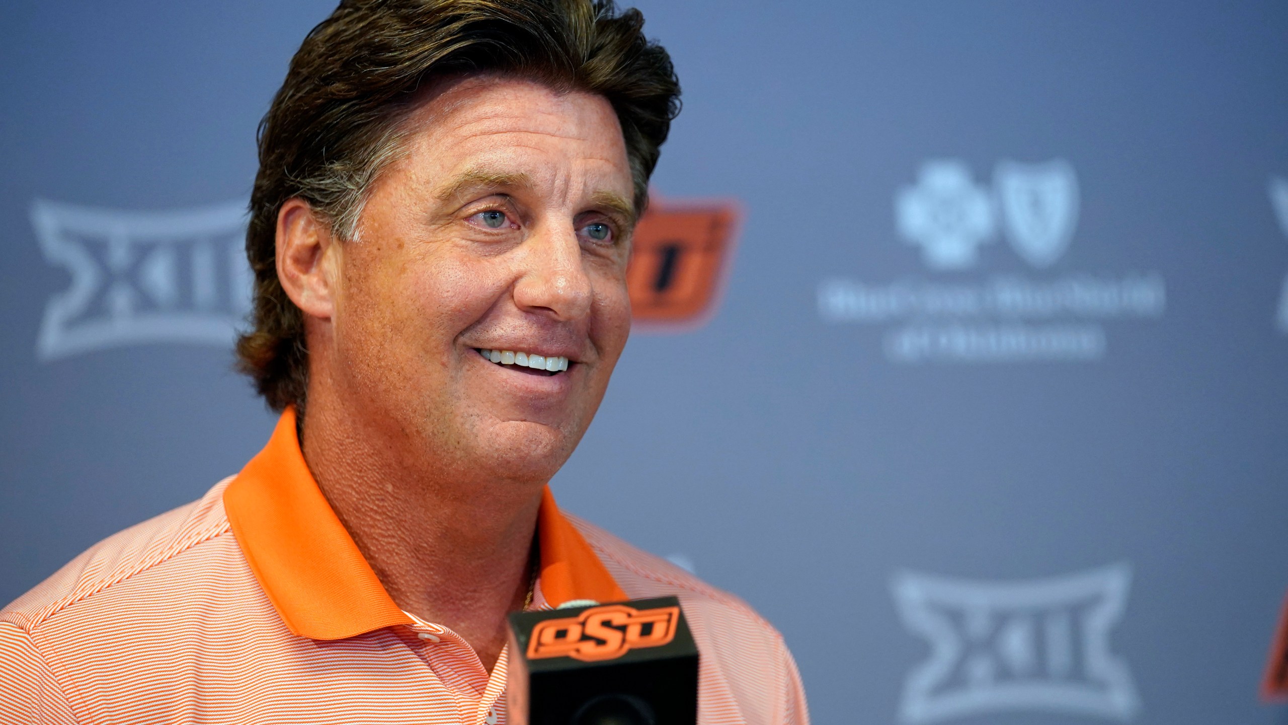 Oklahoma State head coach Mike Gundy answers questions during an NCAA college football news conference Thursday, Aug. 26, 2021, in Stillwater, Okla.