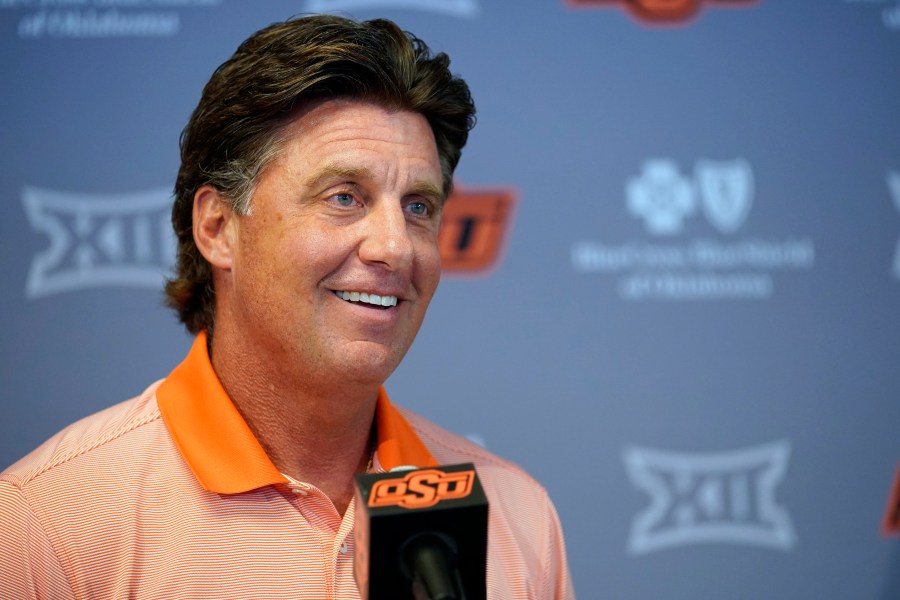 Oklahoma State head coach Mike Gundy answers questions during an NCAA college football news conference Thursday, Aug. 26, 2021, in Stillwater, Okla.