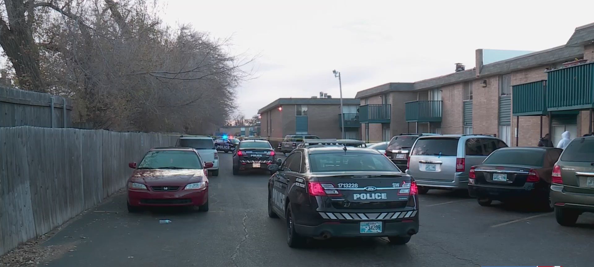 OKCPD vehicle parked outside apartment complex where 1-year-old was shot during an argument between mother and boyfriend