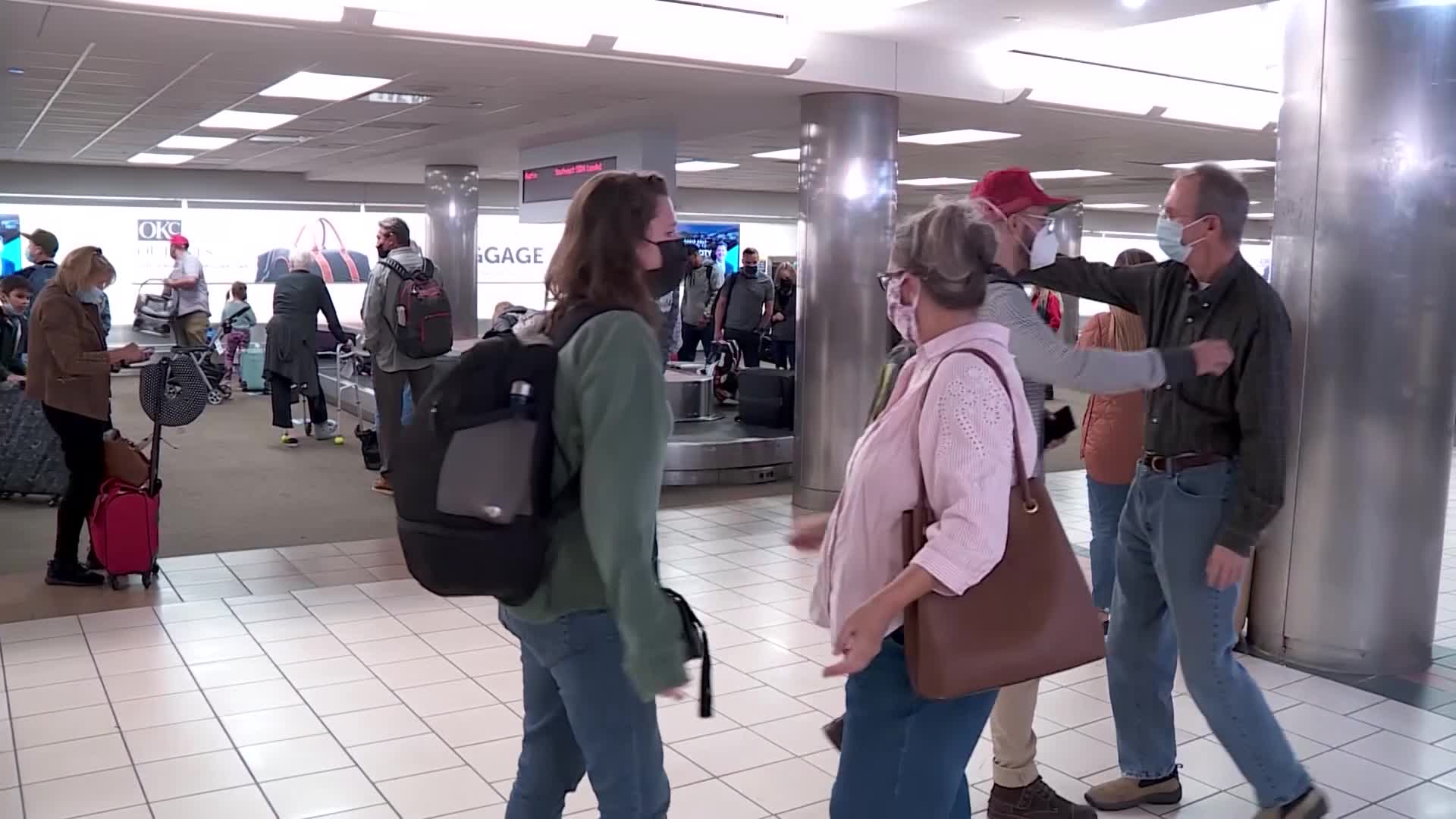 Travelers reunite at Will Rogers World Airport baggage claim